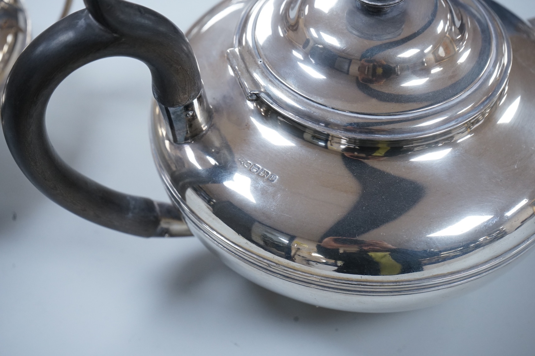 A George V three piece silver tea set, each piece of compressed globular form by James Dixon and Sons, Sheffield 1910, 1025g gross
